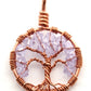 A close up image of the June birthstone tree of life pendant from Uncorked & Bottled Up made with Alexandrite Swarovski crystals and copper wire