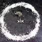 A styled image of the triple goddess pentagram necklace from Uncorked & Bottled Up